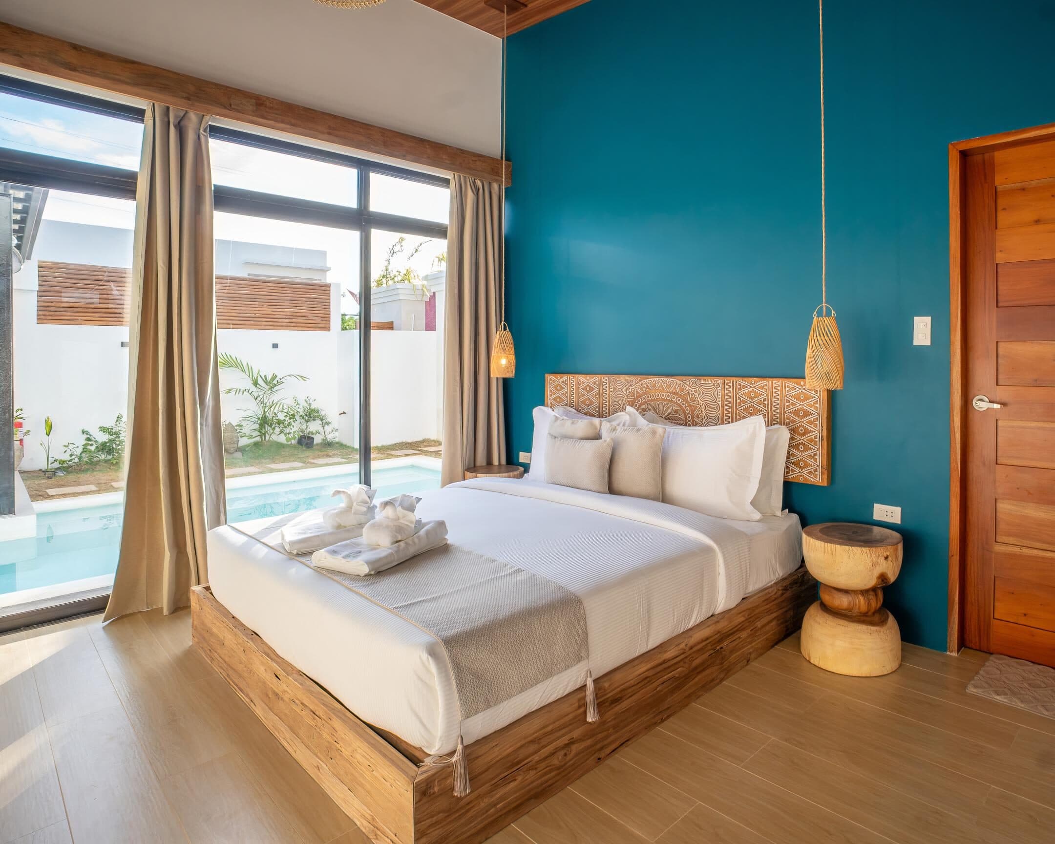 Two-Bedroom Villa bedroom overlooking the private pool