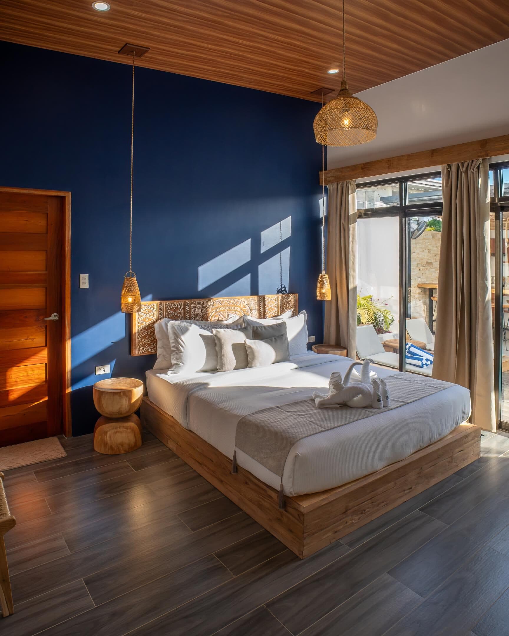 Two-Bedroom Villa bedroom with navy accent wall
